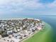 The aerial view shows a vibrant neighborhood close to the beach at 866 N Shore Dr, Anna Maria, FL 34216