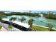 Beautiful aerial view of waterfront condos with boat access, carports, and lush landscaping at 9397 Midnight Pass Rd # 603, Sarasota, FL 34242