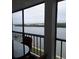 Balcony view showcasing scenic waterfront and lush landscape at 9397 Midnight Pass Rd # 603, Sarasota, FL 34242