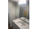 Bathroom with updated vanity and double sinks at 9397 Midnight Pass Rd # 603, Sarasota, FL 34242