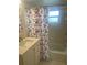 Bathroom with updated vanity, tub, and shower at 9397 Midnight Pass Rd # 603, Sarasota, FL 34242