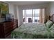 Main bedroom with king-size bed and water views at 9397 Midnight Pass Rd # 603, Sarasota, FL 34242