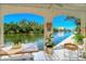 A covered lanai offers scenic views of the canal at 9397 Midnight Pass Rd # 603, Sarasota, FL 34242