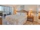 Main bedroom with water views and balcony access at 9397 Midnight Pass Rd # 603, Sarasota, FL 34242