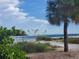 Scenic beach access with palm trees and vegetation at 111 9Th N St, Bradenton Beach, FL 34217