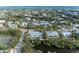 Aerial view showcasing a single-Gathering home's waterfront lot and neighborhood context at 115 Los Cedros Dr, Anna Maria, FL 34216