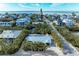 Aerial view of a single-Gathering home with a pool near the beach and waterway at 115 Los Cedros Dr, Anna Maria, FL 34216