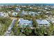 Aerial view of a single-Gathering home with pool, situated in a residential neighborhood near the ocean at 115 Los Cedros Dr, Anna Maria, FL 34216
