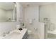 Elegant bathroom with a quartz countertop and walk-in shower at 115 Los Cedros Dr, Anna Maria, FL 34216
