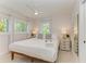 Spacious bedroom with king-size bed and large windows at 115 Los Cedros Dr, Anna Maria, FL 34216