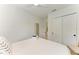 Bright bedroom with a queen bed and closet at 115 Los Cedros Dr, Anna Maria, FL 34216