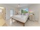 Main bedroom with a queen bed and direct access to a private bathroom at 115 Los Cedros Dr, Anna Maria, FL 34216