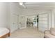 Bedroom with French doors opening to the dining area at 115 Los Cedros Dr, Anna Maria, FL 34216