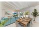 Modern dining room adjacent to living area, seats six at 115 Los Cedros Dr, Anna Maria, FL 34216