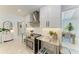 Updated kitchen featuring stainless steel countertops and range at 115 Los Cedros Dr, Anna Maria, FL 34216