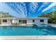 Large pool with plenty of patio space for lounging at 115 Los Cedros Dr, Anna Maria, FL 34216