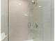 Modern shower with glass enclosure and subway tile at 115 Los Cedros Dr, Anna Maria, FL 34216