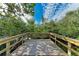 Tranquil wooden deck offering a peaceful waterfront view at 115 Los Cedros Dr, Anna Maria, FL 34216