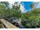 Picturesque wooden deck with tranquil waterfront views at 115 Los Cedros Dr, Anna Maria, FL 34216