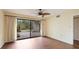 Bedroom with patio access and ceiling fan at 123 Pinehurst Dr, Bradenton, FL 34210