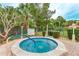 Relaxing community hot tub surrounded by lush landscaping at 123 Pinehurst Dr, Bradenton, FL 34210