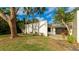 Single story home with patio and tropical landscaping at 123 Pinehurst Dr, Bradenton, FL 34210