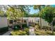 Attractive condo exterior with lush landscaping and private patio at 123 Pinehurst Dr, Bradenton, FL 34210