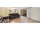 Living room with dark leather furniture and sliding glass doors at 123 Pinehurst Dr, Bradenton, FL 34210