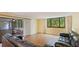 Bright living room with hardwood floors and access to a relaxing screened porch at 123 Pinehurst Dr, Bradenton, FL 34210