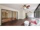 Relaxing screened porch with a view of the lush greenery and wood-like flooring at 123 Pinehurst Dr, Bradenton, FL 34210