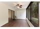 Bright and airy screened porch with wood-look flooring and white wicker chairs at 123 Pinehurst Dr, Bradenton, FL 34210