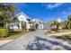 Two-story home with stone accents and a paver driveway at 12411 Highfield Cir, Lakewood Ranch, FL 34202