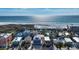 Aerial view of a charming beach house, near the ocean, with lush landscaping at 126/128 Avenida Veneccia, Sarasota, FL 34242
