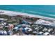 Scenic aerial view showcasing the property's prime location near the beach and the vibrant neighborhood at 126/128 Avenida Veneccia, Sarasota, FL 34242