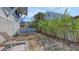 Cozy backyard deck area with comfortable chairs and tables for outdoor seating and enjoyment at 126/128 Avenida Veneccia, Sarasota, FL 34242
