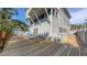 Wooden backyard deck providing an ideal outdoor space for relaxation and entertainment at 126/128 Avenida Veneccia, Sarasota, FL 34242