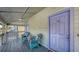 Charming balcony with seating, light fixtures, and a view of the lush outdoor scenery at 126/128 Avenida Veneccia, Sarasota, FL 34242