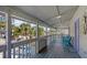 View from a spacious balcony overlooking the street and lined with palm trees at 126/128 Avenida Veneccia, Sarasota, FL 34242