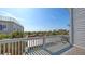 Picturesque balcony view overlooking tropical landscape and distant ocean at 126/128 Avenida Veneccia, Sarasota, FL 34242
