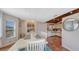 Cozy dining area adjacent to the kitchen, featuring terracotta floors and a bright, airy feel at 126/128 Avenida Veneccia, Sarasota, FL 34242