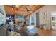 Inviting living room featuring vaulted wood ceilings, a fireplace, and comfortable seating area at 126/128 Avenida Veneccia, Sarasota, FL 34242