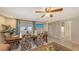 Comfortable living room with stylish furnishings, dining area, and large windows at 126/128 Avenida Veneccia, Sarasota, FL 34242