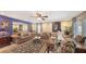 Comfortable living room with stylish furnishings, dining area, and a large mirror at 126/128 Avenida Veneccia, Sarasota, FL 34242