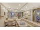Bright main bathroom features double sinks, granite countertops, large mirrors, and bright lighting at 126/128 Avenida Veneccia, Sarasota, FL 34242