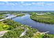 Aerial view of park and river with bridge in background at 13207 49Th E Ln, Parrish, FL 34219