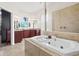 Bathroom with soaking tub, double sinks, and large shower at 13207 49Th E Ln, Parrish, FL 34219