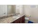 Bathroom with granite countertop and single sink vanity at 13207 49Th E Ln, Parrish, FL 34219