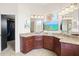 Bathroom with double vanity and walk-in closet access at 13207 49Th E Ln, Parrish, FL 34219
