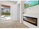 Bedroom with fireplace, pool access and large TV at 13207 49Th E Ln, Parrish, FL 34219