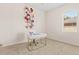 Bedroom with desk and large floral wall art at 13207 49Th E Ln, Parrish, FL 34219